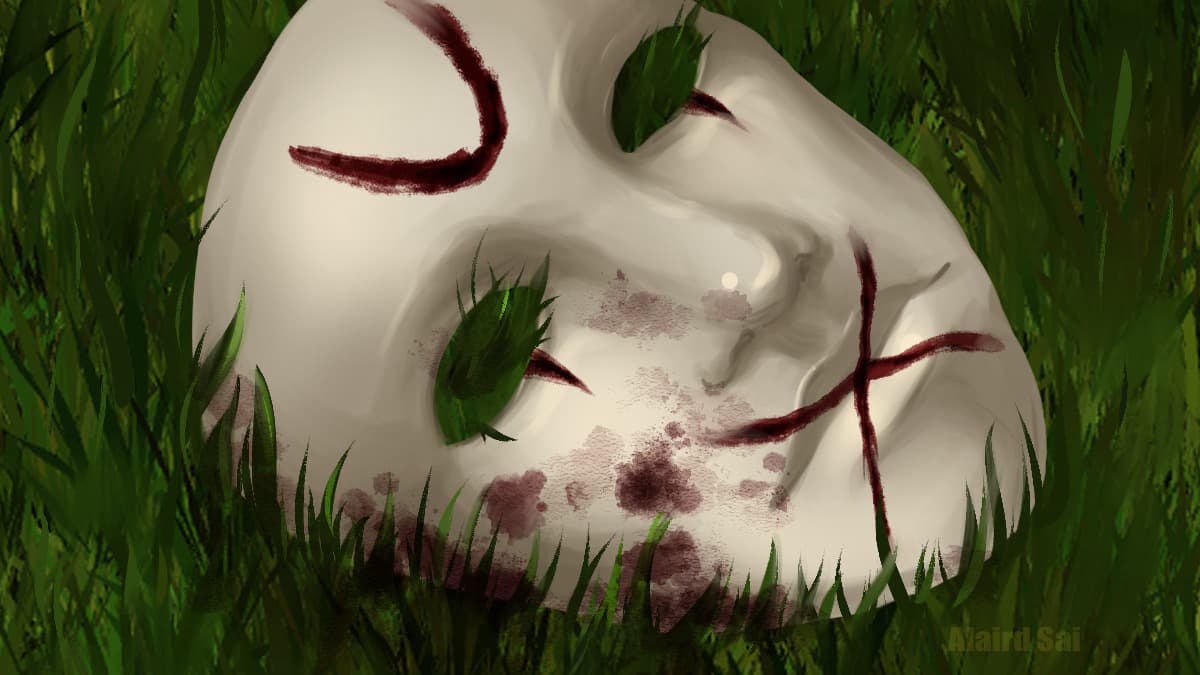 A blood splattered mask with a drawn cross over its mouth and a "U" on the forehead lying in the grass.