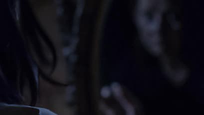 A girl looking into a mirror
